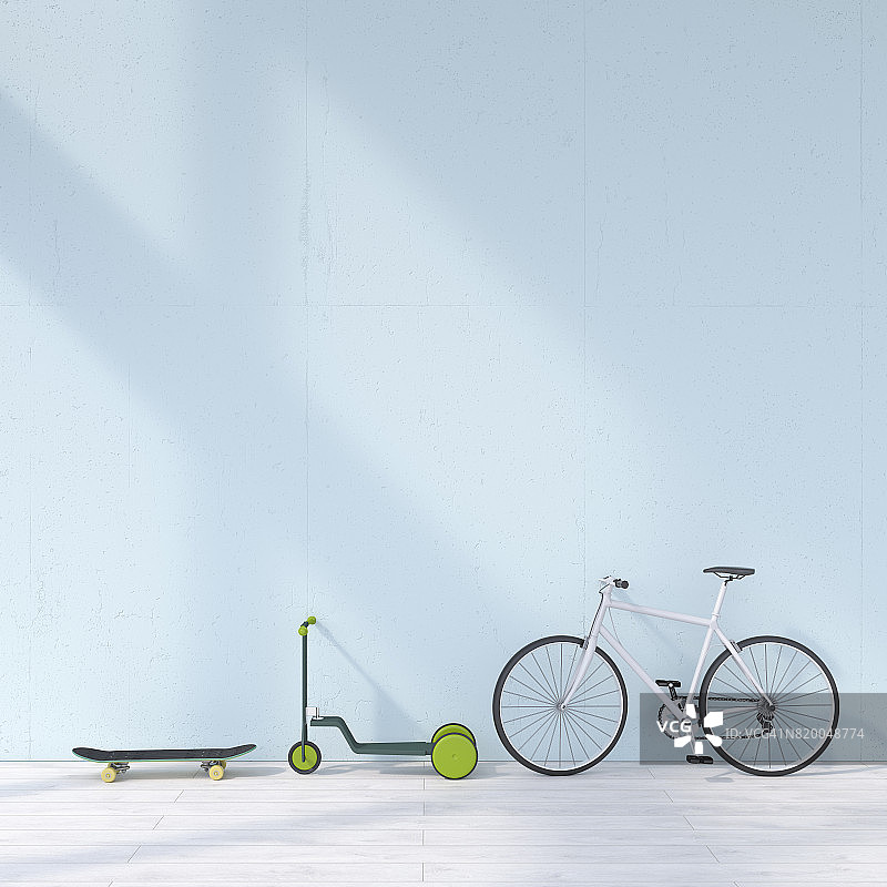 自行車、滑板、踏板車靠在墻上圖片素材