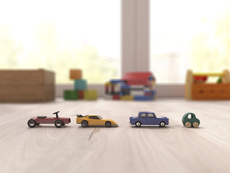 玩具車在游戲室的拼花地板上圖片素材