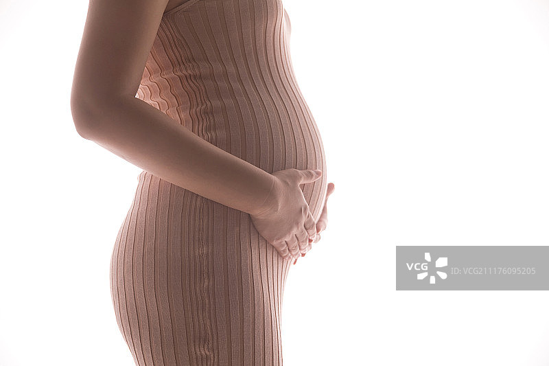 孕妇抚摸肚子图片素材