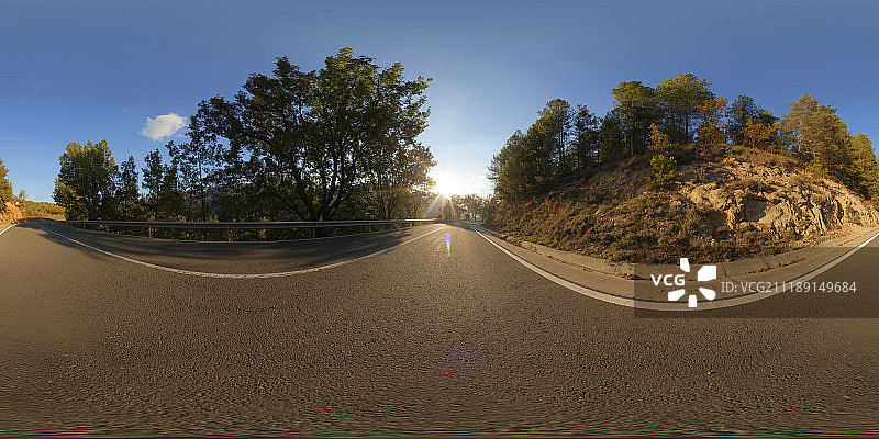 360掳 HDRI showing an asphalt road in a mountainous landscape in Spain图片素材