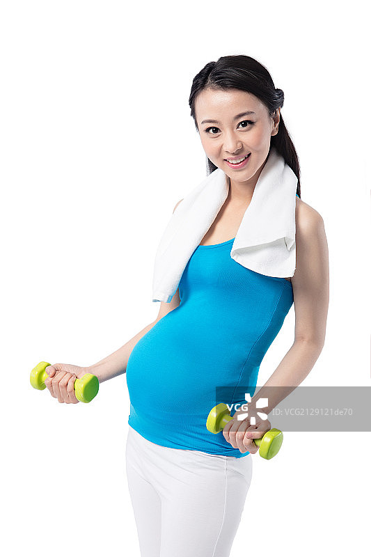 手拿哑铃健身的孕妇图片素材