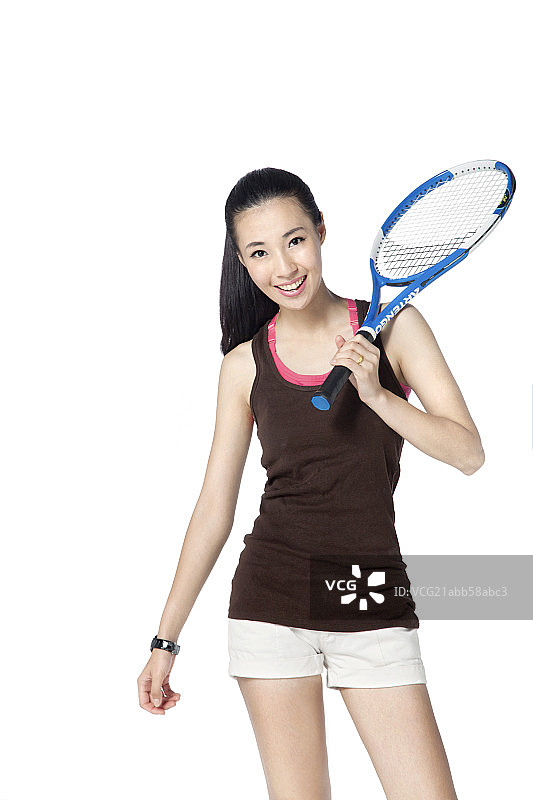 手拿网球拍的时尚少女图片素材