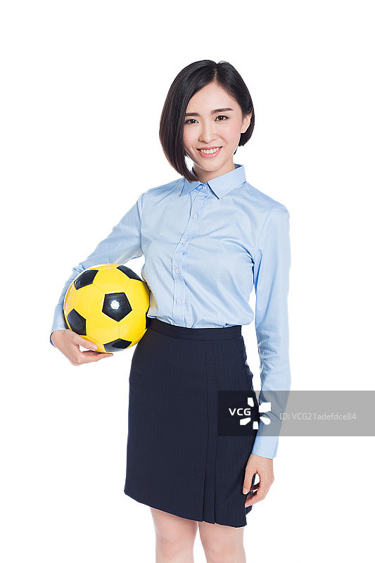 手持足球的商务女士图片素材
