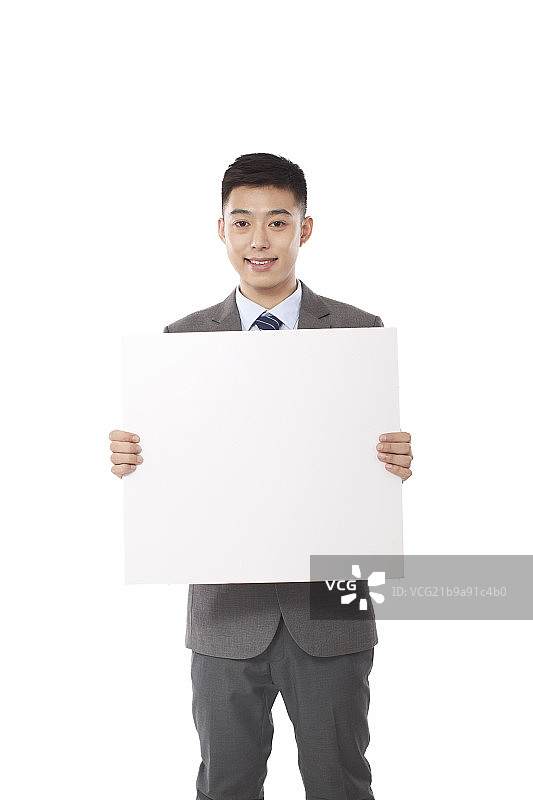 年轻商务男士和白板图片素材