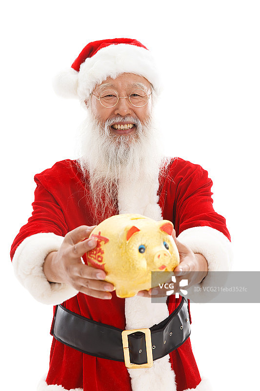 一个穿着圣诞服的老人拿着储蓄罐图片素材