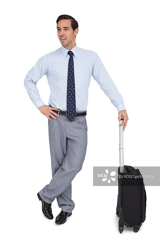 有魅力的商人站在他的手提箱在白色背景图片素材