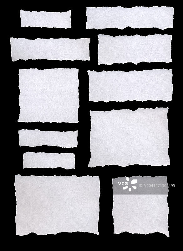 白色的撕纸。孤立在黑色。图片素材