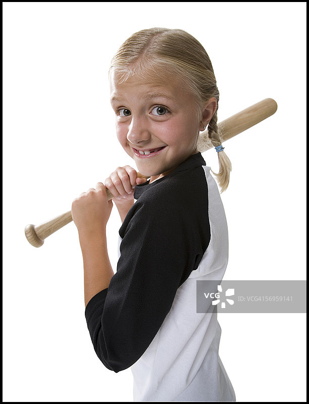 一个拿着棒球棒的女孩的肖像图片素材