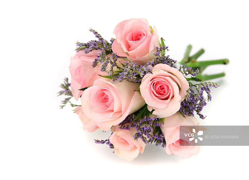 粉红色和淡紫色玫瑰花束孤立在白色上。图片素材
