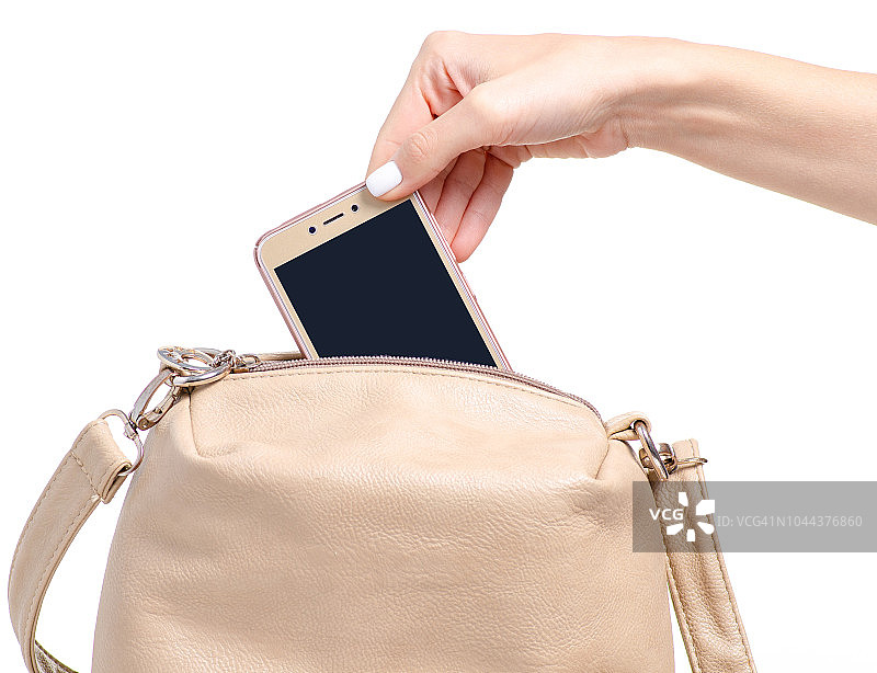 女性米色皮包在手智能手机图片素材