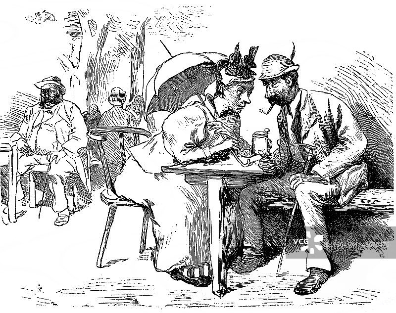 一男一女在一家户外餐厅里讨论- 1896年图片素材