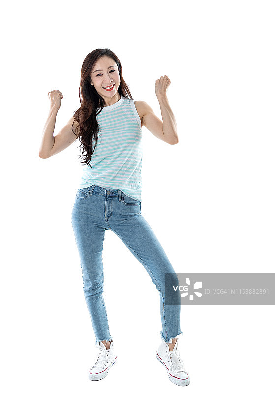幸福的女人紧握拳头在白色的背景图片素材