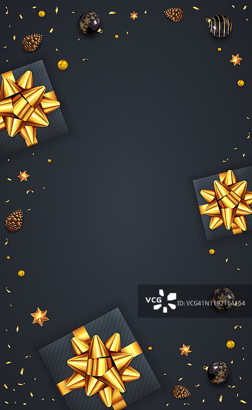 圣诞装饰和礼物与金色的节日鞠躬在黑色的背景图片素材