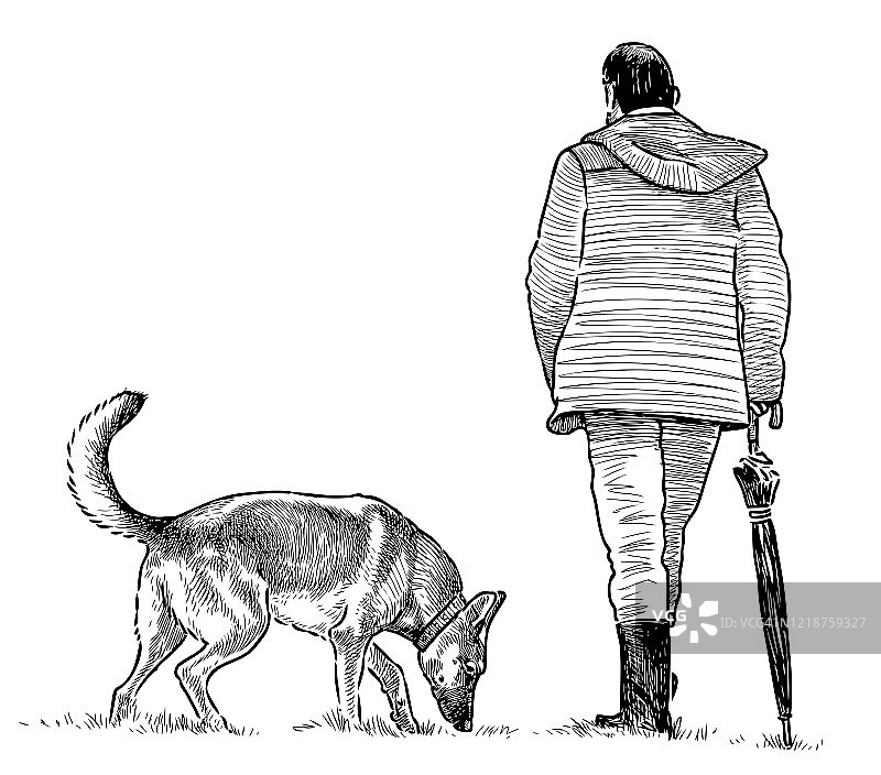 一个人撑着伞和他的狗在散步图片素材