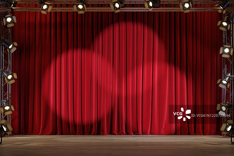 空荡荡的剧院舞台，红色天鹅绒窗帘和聚光灯。图片素材