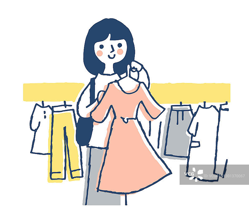 女人在购物时挑选衣服图片素材