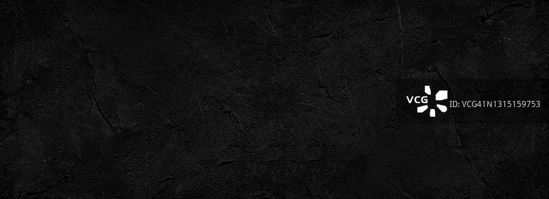 黑色的抽象背景。黑暗的岩石纹理。黑色石材背景与复制空间的设计。网页横幅。图片素材