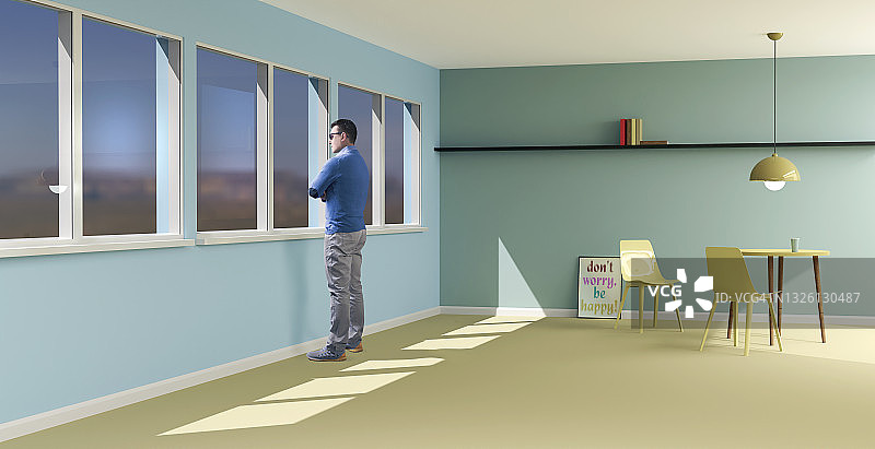 男人站在家里透过窗户看图片素材
