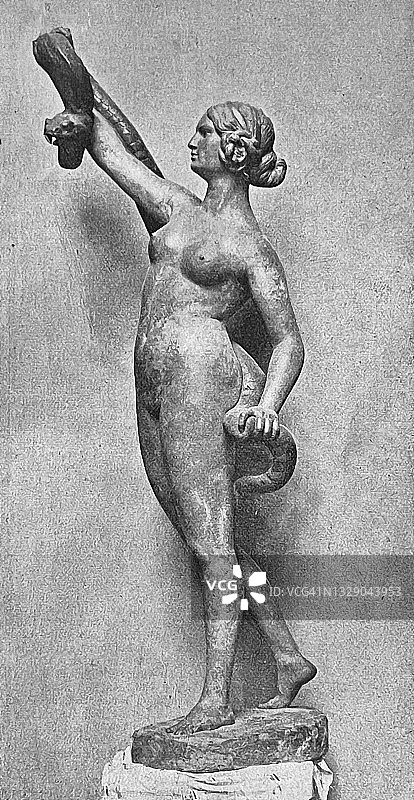 雕像，一个女人正在驯服一条蛇图片素材