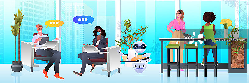 现代机器人服务员在办公室为商务人士服务的人工智能技术概念图片素材