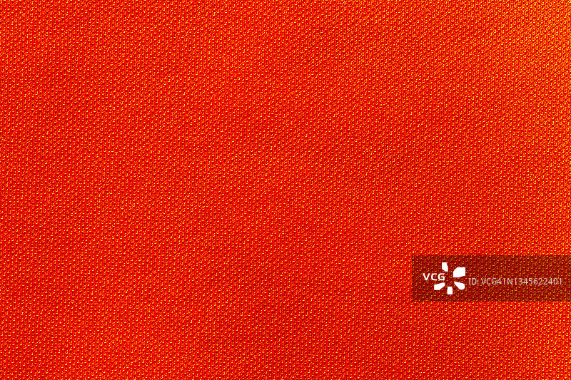 红色运动服装面料，足球衬衫，针织质地和织物背景。图片素材