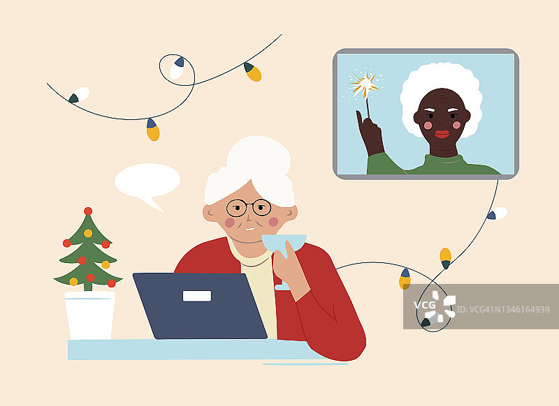 两位老奶奶在网上互祝圣诞快乐。通过互联网进行远距离通信图片素材
