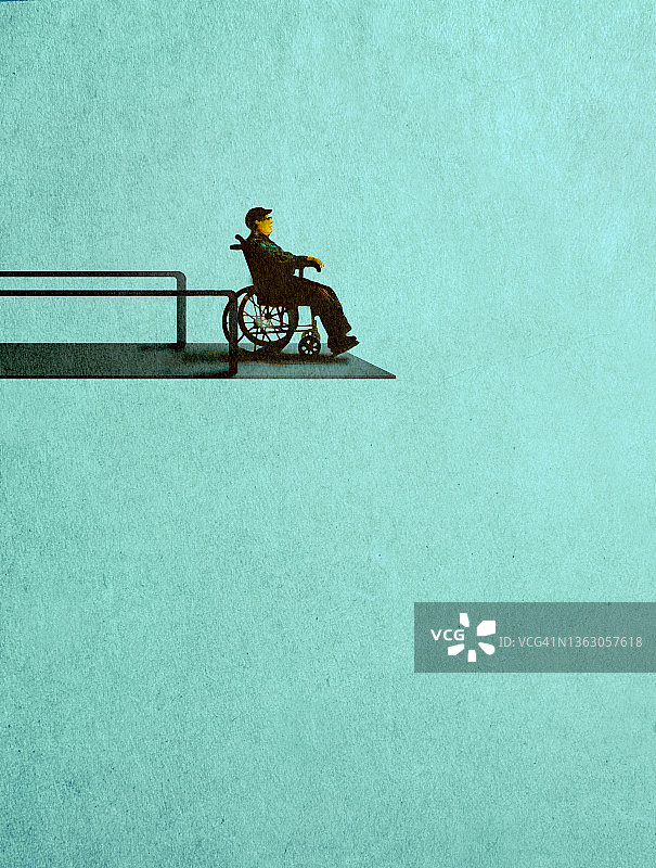 一个坐在轮椅上的人站在高跳板上，描绘了残疾人必须忍受的困难图片素材