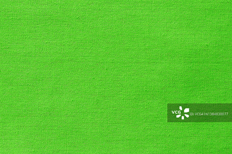 绿色石灰棉织物布料纹理为背景，天然纺织图案。图片素材