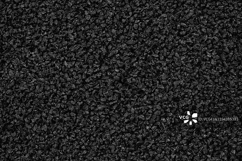 特写黑色塑料聚合物颗粒背景图片素材