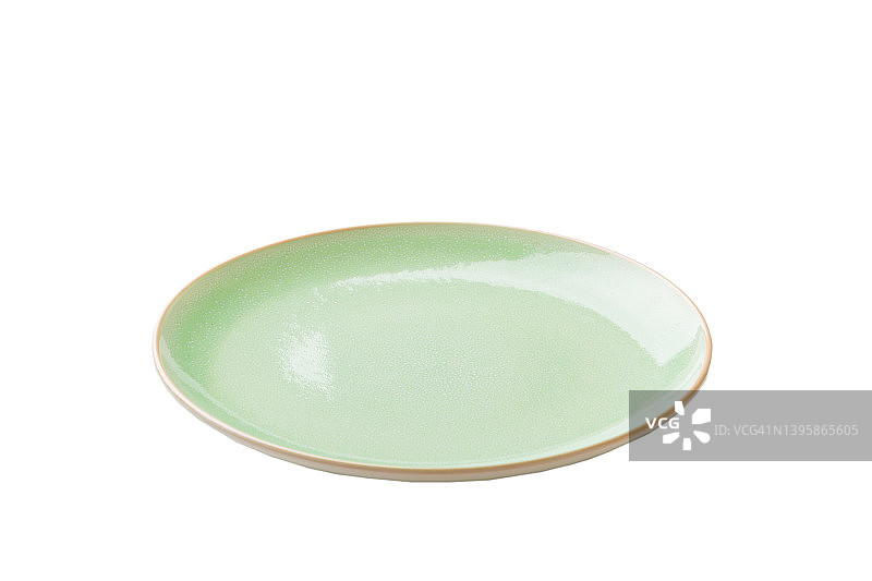 绿色陶瓷圆板孤立在白色背景。透视图图片素材