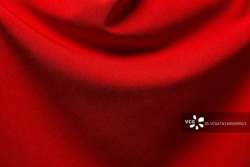 红色布布涤纶纹理和纺织背景。图片素材