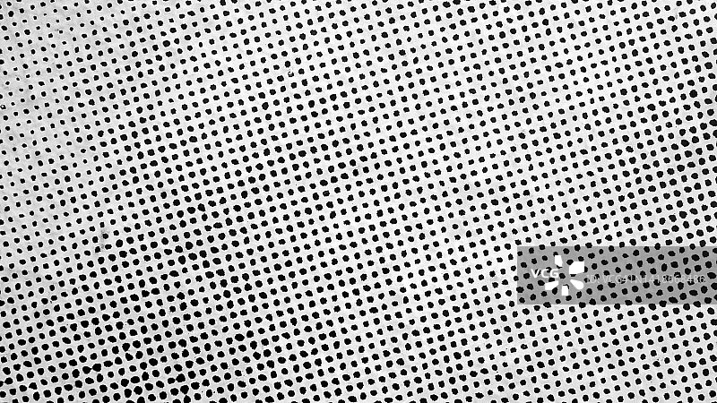 微距照片的小黑点印刷在白纸上在巴黎，法国图片素材