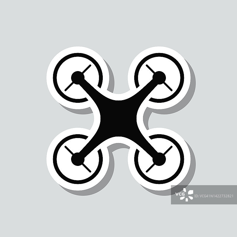 无人机——四轴飞行器。图标贴纸在灰色背景图片素材