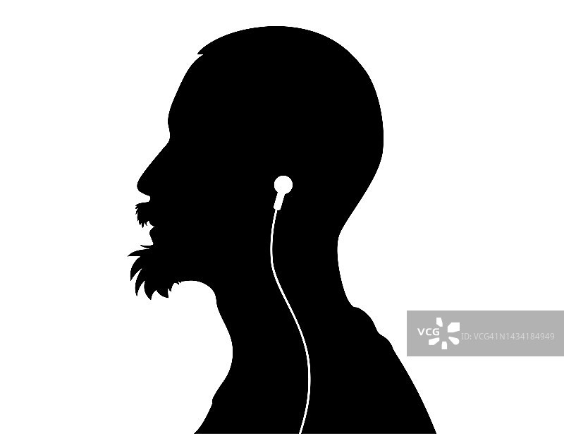 男人戴着耳机听音乐的肖像。图片素材