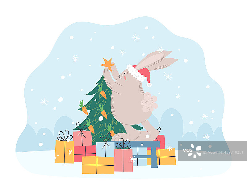 可爱的兔子戴着圣诞老人的帽子装饰圣诞树图片素材