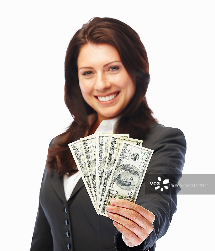 快乐的年轻女商人拿着现金图片素材