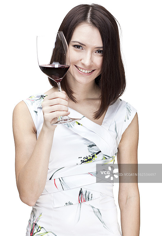 一个漂亮女人拿着一杯红酒的肖像图片素材