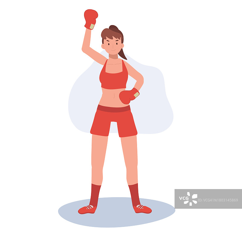积极的运动女子拳击与信心。强大的女拳击手在健身房锻炼图片素材