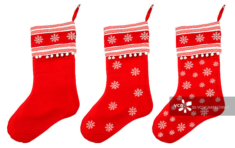 红色的圣诞袜，上面有白色的雪花，作为圣诞老人的礼物图片素材