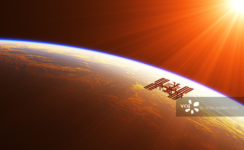 国际空间站在旭日的光芒中图片素材