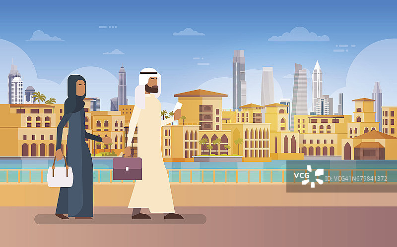 阿拉伯夫妇步行迪拜，现代建筑城市景观天际线全景商务旅行和旅游概念图片素材