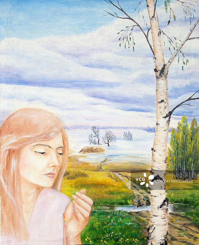 一个女孩在风景中拿着蜡烛的肖像。图片素材