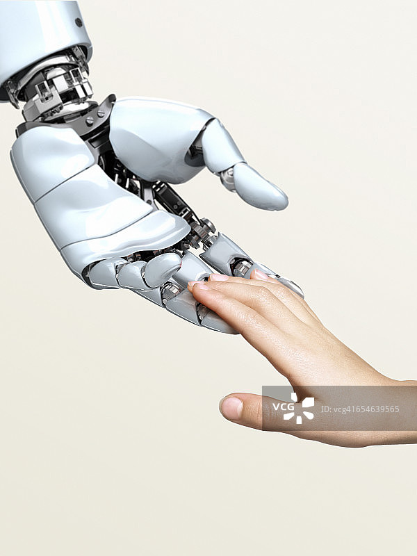 机器人的手触摸孩子的指尖图片素材