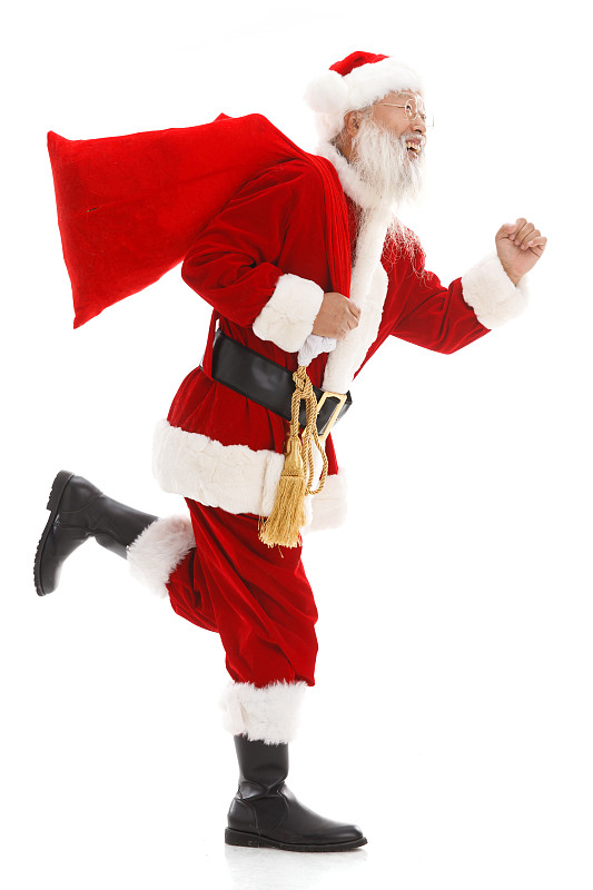 一个圣诞老人背着布袋在奔跑图片下载