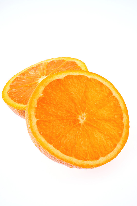 橙子的两半，在摄影棚拍摄图片下载