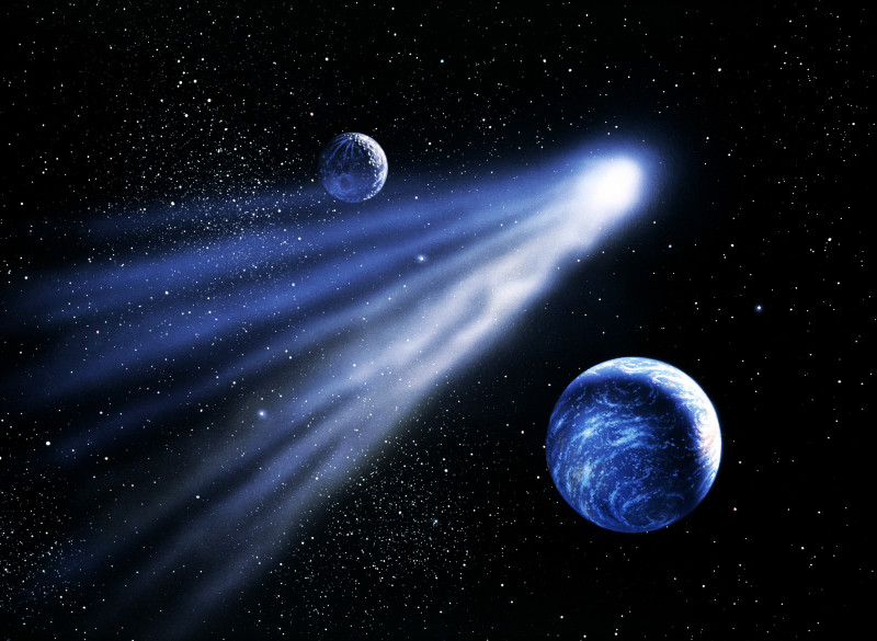 彗星在地球和月球之间翱翔(数字增强)图片素材
