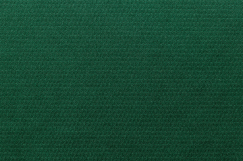 绿色运动服装面料，足球衫面料，运动衫纹理和织物背景。摄影图片