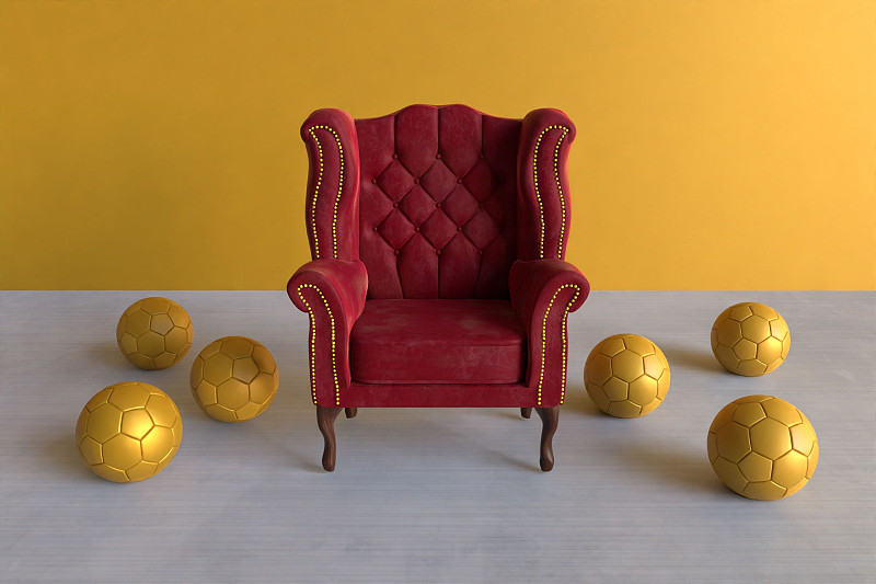 3d渲染红色天鹅绒翼椅被六个金色足球包围图片下载