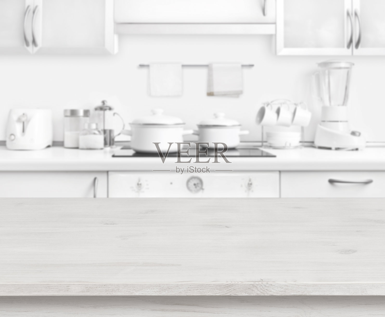 木质餐桌上的白色现代厨房室内背景，色彩柔和照片摄影图片