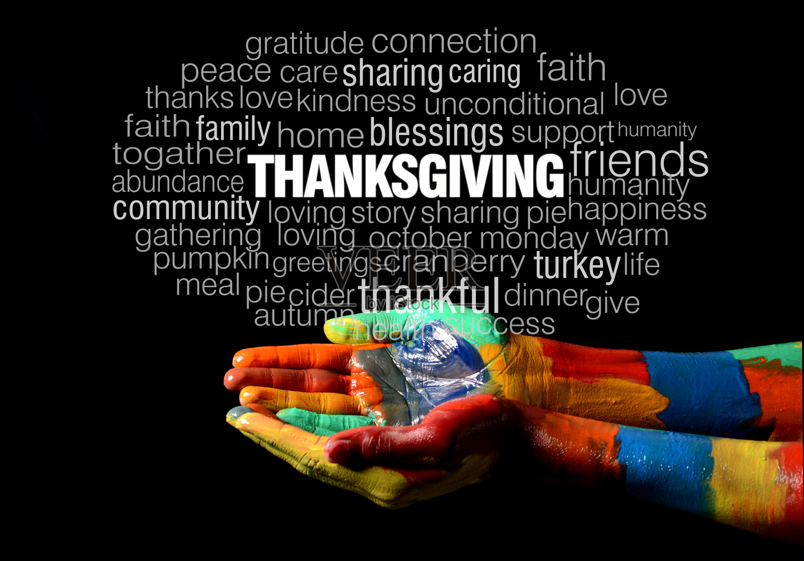 快乐的感恩节文字拼贴在彩色的手绘手上照片摄影图片